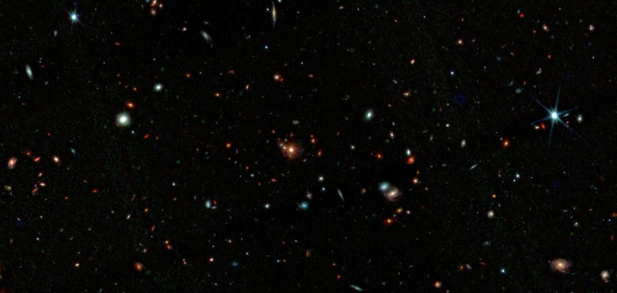 Протокластер Паутина, запечатлённый JWST. Это цветное составное изображение объединяет наблюдения JWST на длинах волн 1,2 мкм
